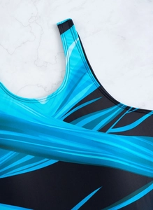 Close-up of sky blue and black athletic swimsuit fabric with professional flatlock stitching