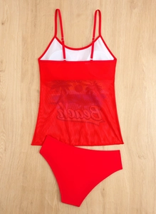 Close-up of red tankini top with sheer mesh panel and tropical Beach sunset print