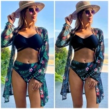 Detailed macro view of tropical floral print bikini set with long sleeve mesh cardigan cover-up