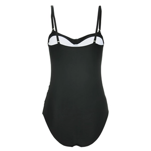 Detail view of black one-piece swimsuit with thin straps and white built-in chest pads