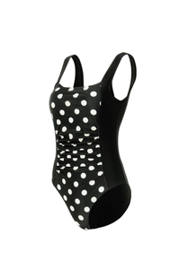 Detail of black one-piece swimsuit with white polka dots and ruched slimming waist panel