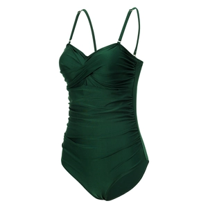 Detail of dark green one-piece swimsuit featuring ruching tummy control and twisted bust