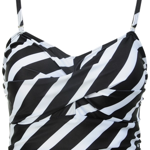 Detail of swimsuit with black and white diagonal stripes and twisted cross chest design