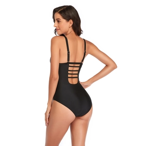Detail of sexy black one-piece swimsuit with multiple horizontal back straps and cut-out