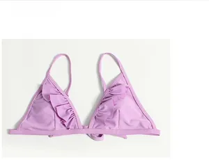 Detail view of lavender ruffle bikini top with high-elastic fabric and refined stitching