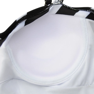 Detail of built-in round sponge bra pads and black striped fabric on one-piece swimwear