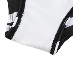 Detailed macro view of zebra print swimsuit crotch with white lining and neat black stitching
