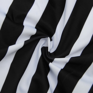 Detailed macro view showing the soft texture and vertical stripe pattern of swimsuit fabric