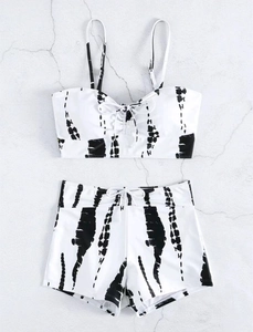 Detailed flat lay of tie-dye high waisted bikini set with drawstring front and boy shorts