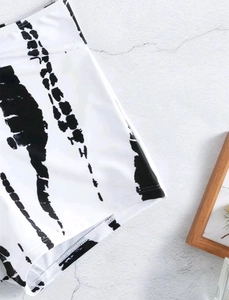 Close-up of black and white abstract print on high-waisted bikini bottoms with flat seams