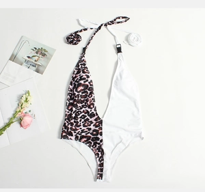 Detail of deep V-neck one-piece swimsuit with leopard print, color block and buckle