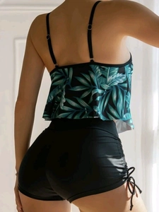 Detail view of tropical leaf print bikini top with ruffled hem and drawstring high waist shorts