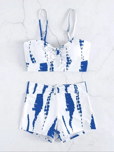 Flat lay of blue tie-dye high waisted bikini set with front drawstring and boyshorts