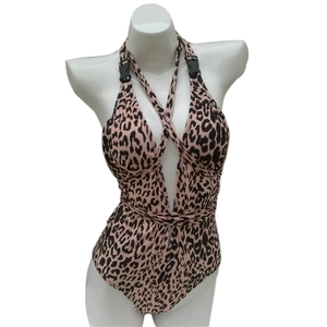 Detailed close-up of leopard print swimsuit with plunging V-neck and buckle strap detail