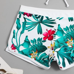 Dettaglio slip bikini a vita alta con stampa floreale tropicale e fascia elastica