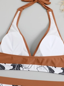 Detail of bikini top showing the brown halter neck design and removable padded cups