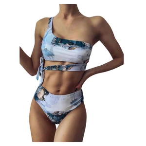 Detailed view of tie-dye marble print bikini with one-shoulder design and side ties