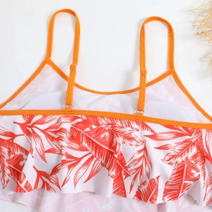 Detail of tropical palm leaf print bikini top with ruffled trim and adjustable straps