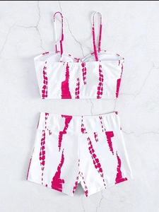Detail of high waist tie-dye bikini set with drawstring shorts and knotted top