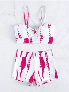 Detailed flat lay of pink tie-dye high waisted bikini set with front drawstring top