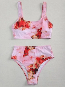 Close-up of marble print bikini set with pink and gold ink wash on high-elastic fabric