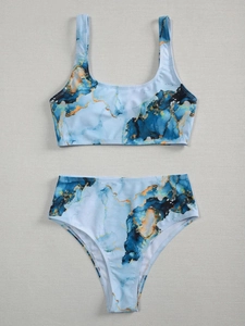 Detailed flat lay of a blue and gold marble print two-piece high waisted bikini set