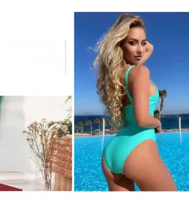 Detail of mint green one-piece swimsuit featuring a sexy backless cut and stretchy fabric