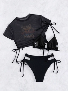 Detailed flat lay of three-piece black bikini set with mesh top and drawstring high waist