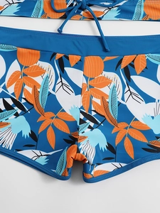 Dettaglio slip bikini a vita alta con stampa tropicale e coulisse regolabile in vita
