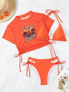 Detail view of orange three-piece bikini set with mesh top and drawstring swim bottom
