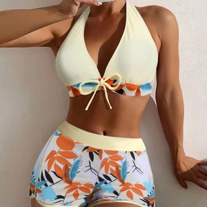 Two-piece halter bikini set with high-waisted shorts and tropical floral print pattern