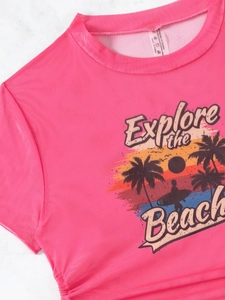 Detail of rose pink mesh t-shirt with retro beach print and ribbed crew neckline