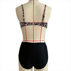 Back view of leopard print bikini top with adjustable straps and black high-waisted bottoms