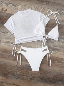Detailed flat lay of white three-piece bikini set with mesh top and high waist bottom