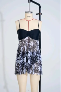 Detail view of the high waist mesh tankini featuring contrast coconut palm tree print