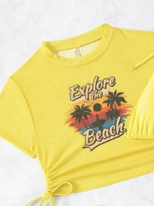 Detail of yellow beach t-shirt with tropical graphic print and side drawstring ties