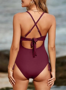 Detailed back view of burgundy ribbed one-piece swimsuit with lace-up drawstring and cross straps
