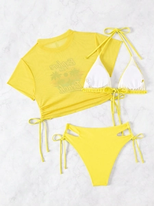 Detail of yellow bikini set featuring mesh t-shirt with palm tree print and side tie bottoms