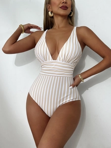 Detail of V-neck striped one-piece swimsuit with khaki and white vertical patterns
