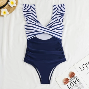 Detail of V-neck one-piece swimsuit with blue stripes, ruffle trim and waist cutout