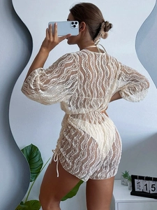 Elegante copricostume bikini bianco in rete trasparente a maniche lunghe con ricamo