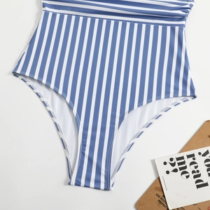 Detail of blue and white vertical stripe swimsuit showing high-cut leg and elastic fabric