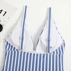 Detail view of blue striped swimsuit with adjustable metal buckle and built-in white chest pads