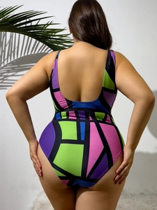 U-shaped open back detail on a colorful geometric patchwork plus size one-piece swimsuit
