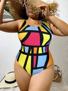 Detail of plus size swimsuit with bold geometric color blocks and artistic Mondrian style