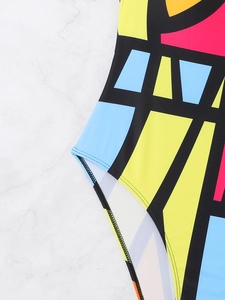 Macro view of high-stretch fabric with colorful geometric patterns and fine stitching detail
