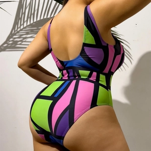 One-piece plus size swimsuit with colorful geometric patterns and open back design