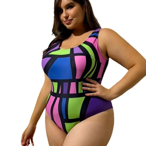 Plus size one piece swimsuit featuring vibrant geometric color blocks and black piping details