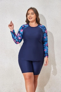 Detail of plus size long sleeve tankini top with tropical palm leaf print on sleeves