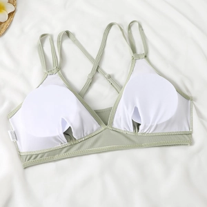 Detail of light green ribbed bikini top with adjustable straps and removable pads